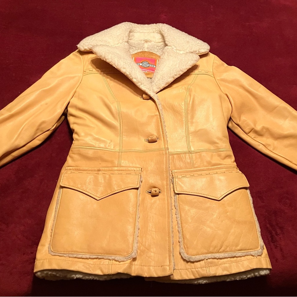 Vintage Ms. Pioneer western leather coat, size 10, detailed stitching.
